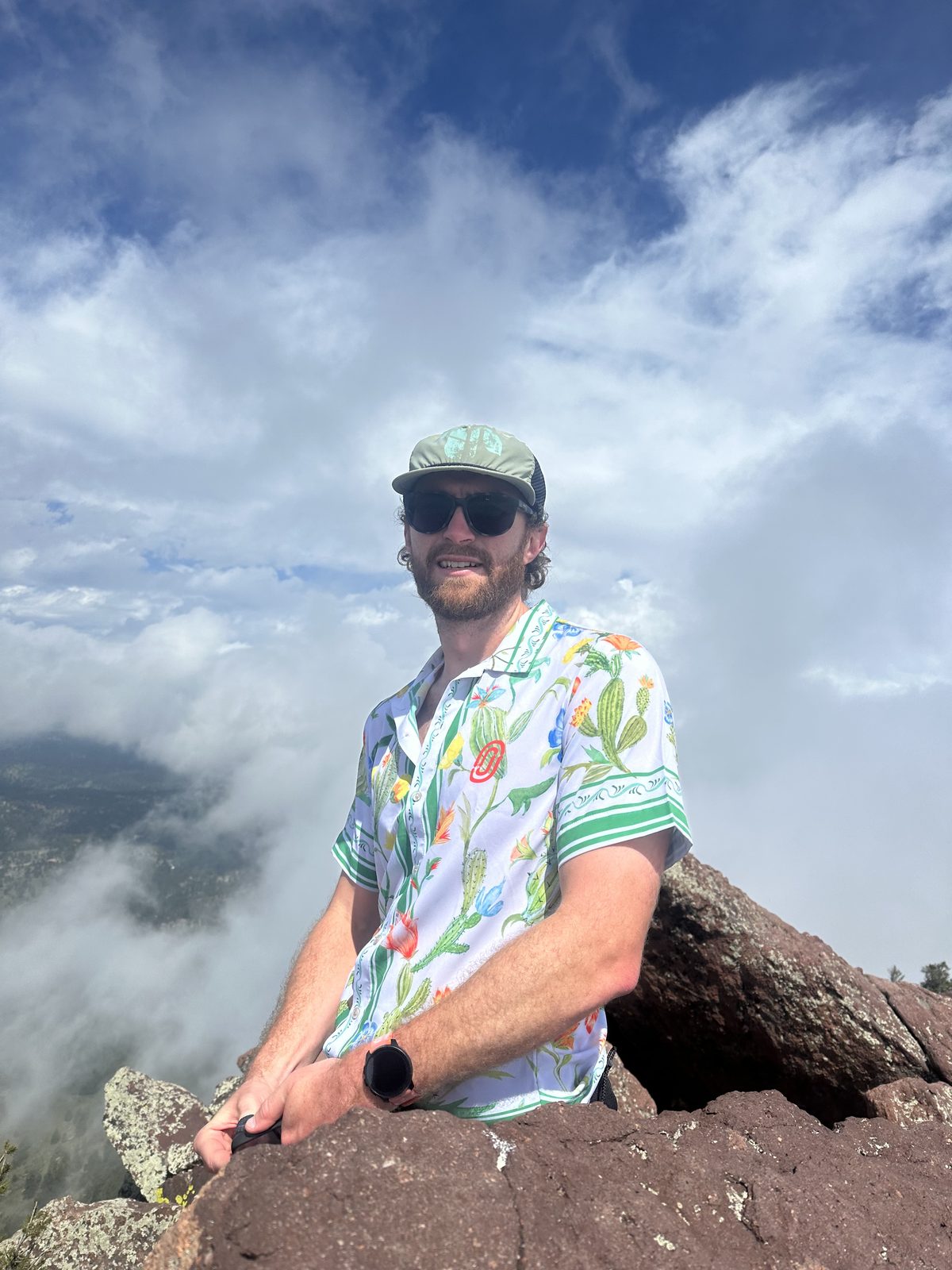 Jacob Fisher on a Front Range summit above the clouds